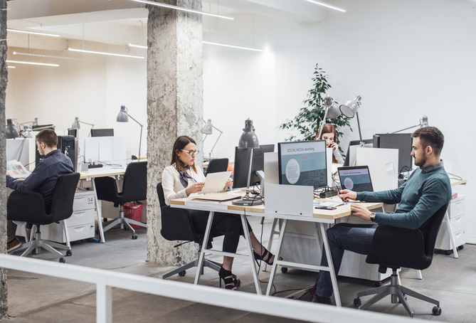 People working together in a shared space office.